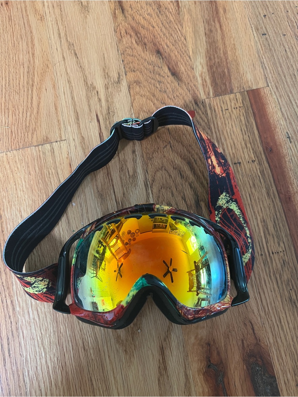 Oakley Ski/Snowboard Goggles with Orange-Yellow Lens and Patterned Strap